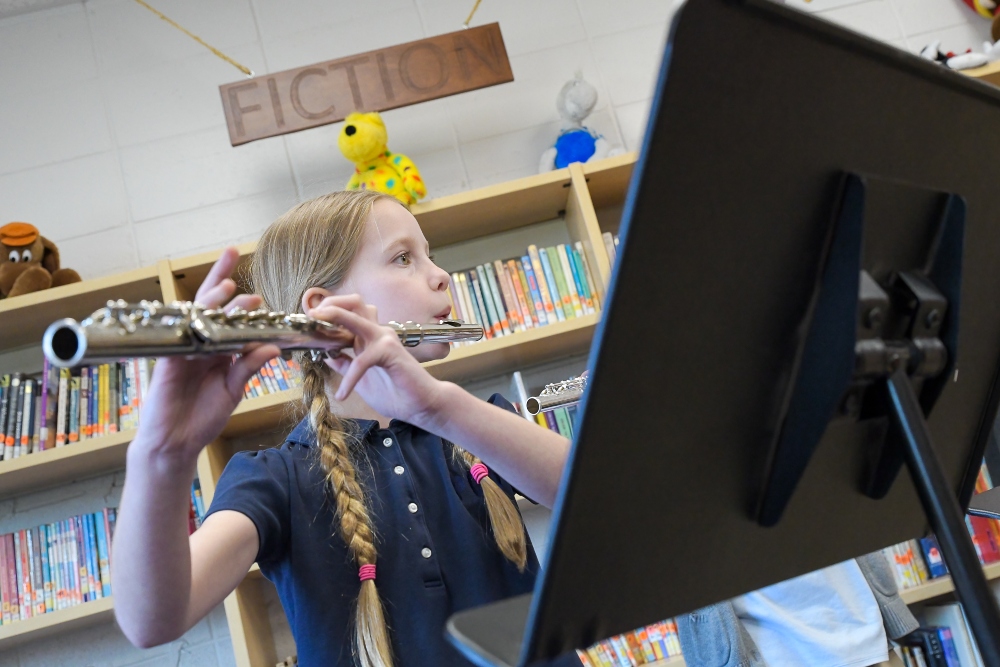 Elementary school girls plays flute