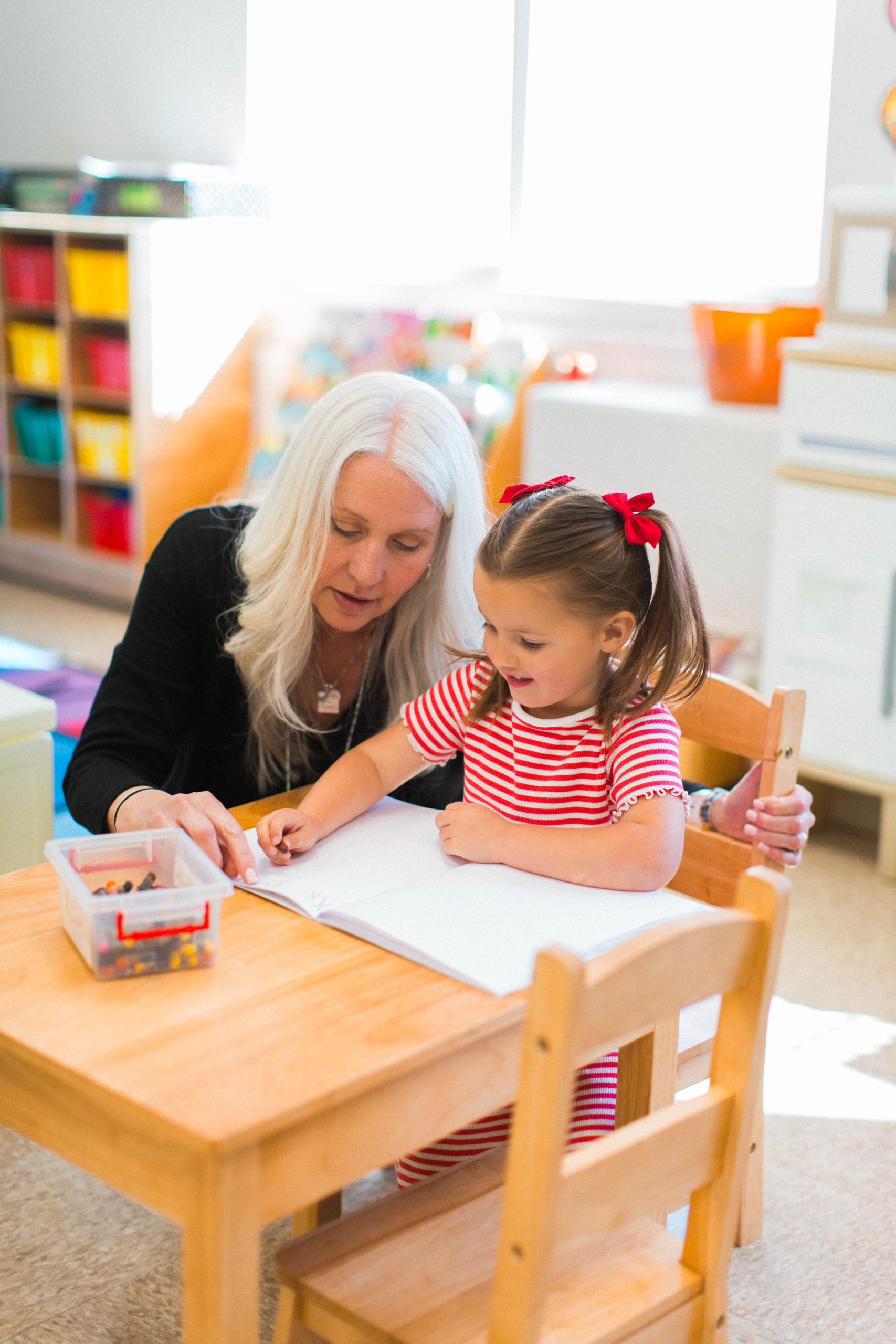 Jennifer Mott, Preschool 3's teacher, reading with students