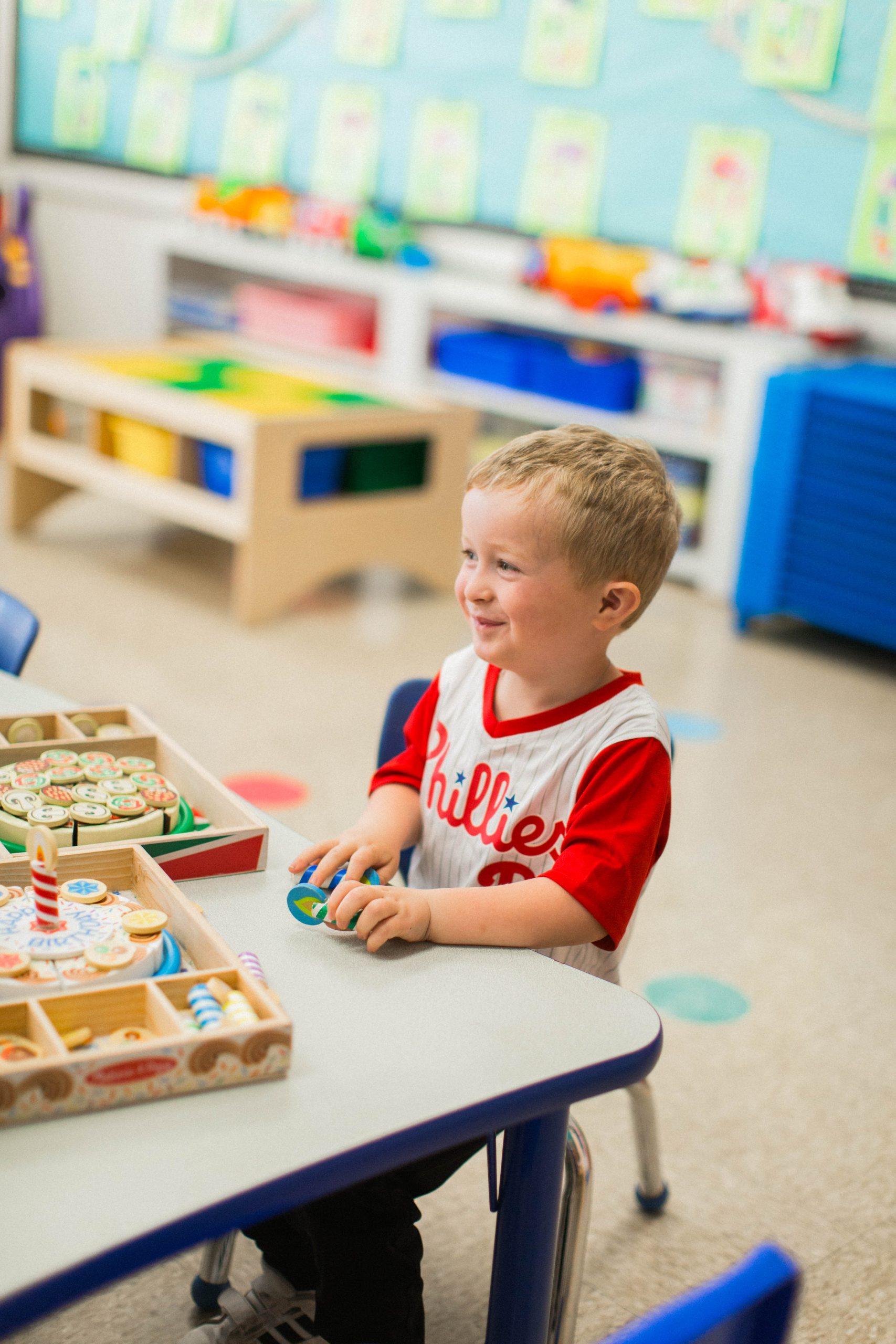 Preschool 3s child engaged in play-based learning